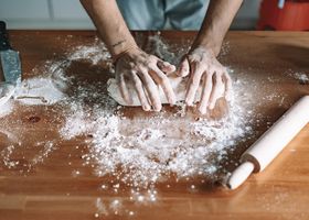 Hands at the board, dough under flour — from 