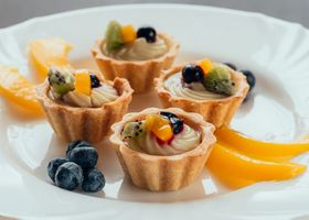 A fruit tart, kept to the scale of the meal that preceded it.